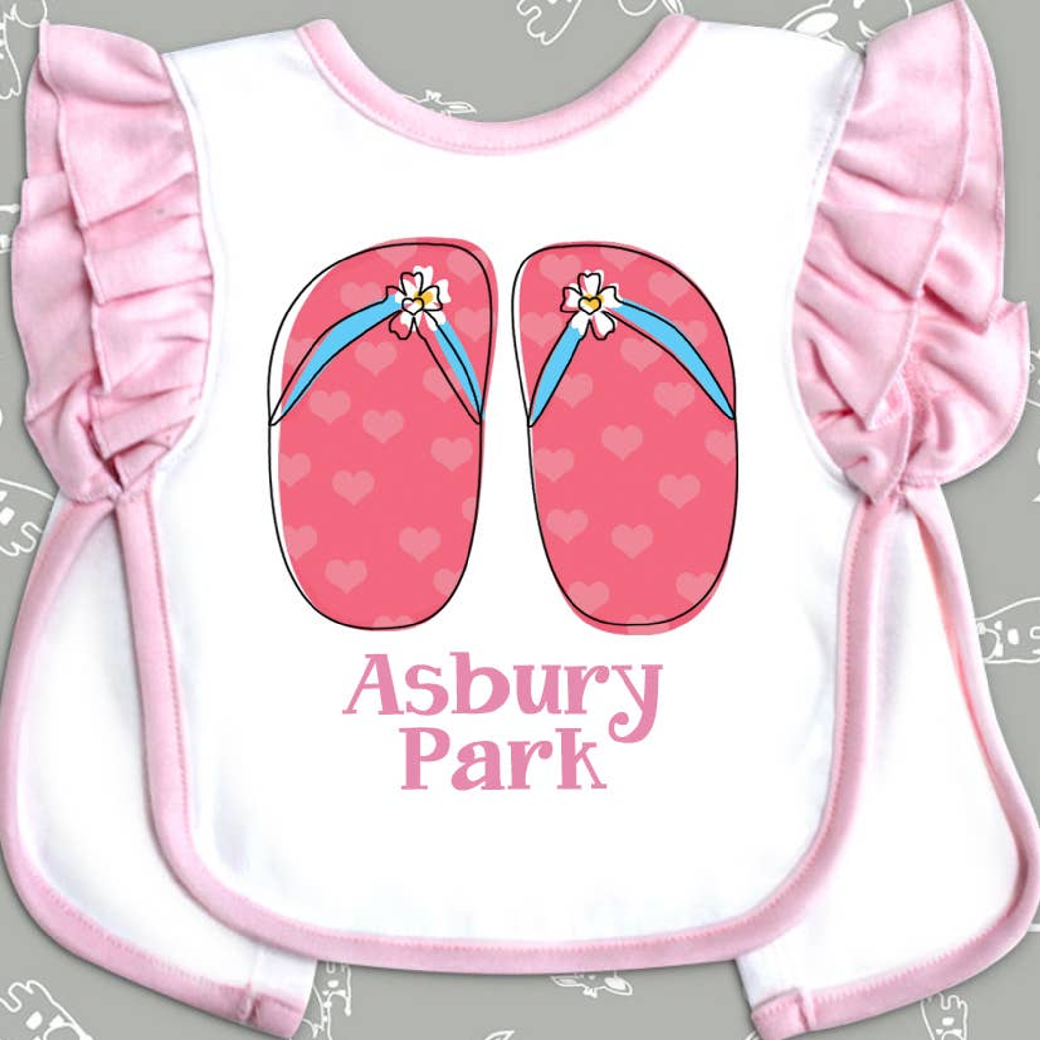 Bib para bebés con cierre de lazo estampado 2 capas color blanco y rosa 65% poliéster 35% algodón personalizable y lavable a máquina