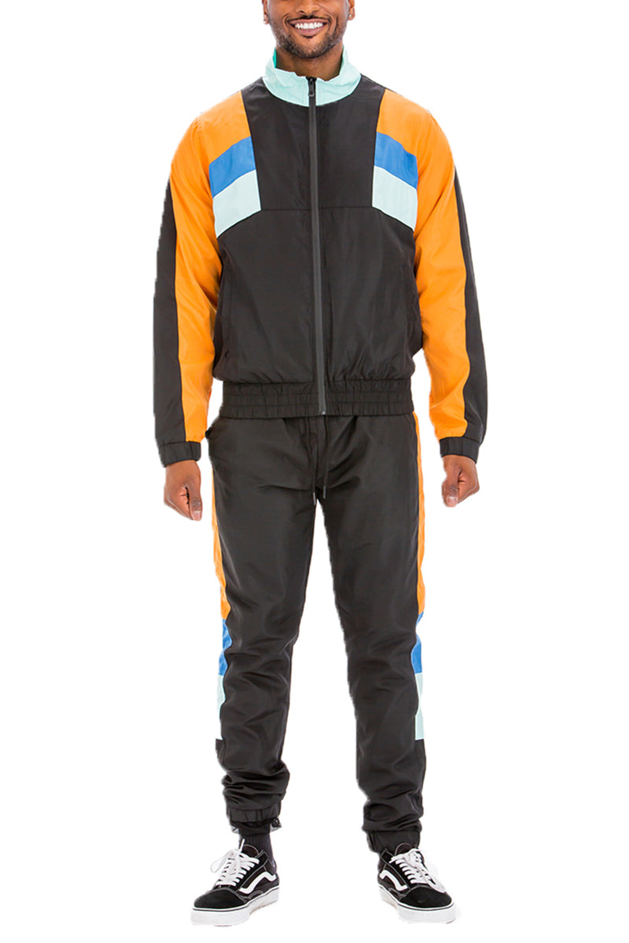 Chaqueta cortavientos y pantalones chándal de poliéster tamaño mediano color no especificado con cintura y tobillos elásticos lavable a máquina